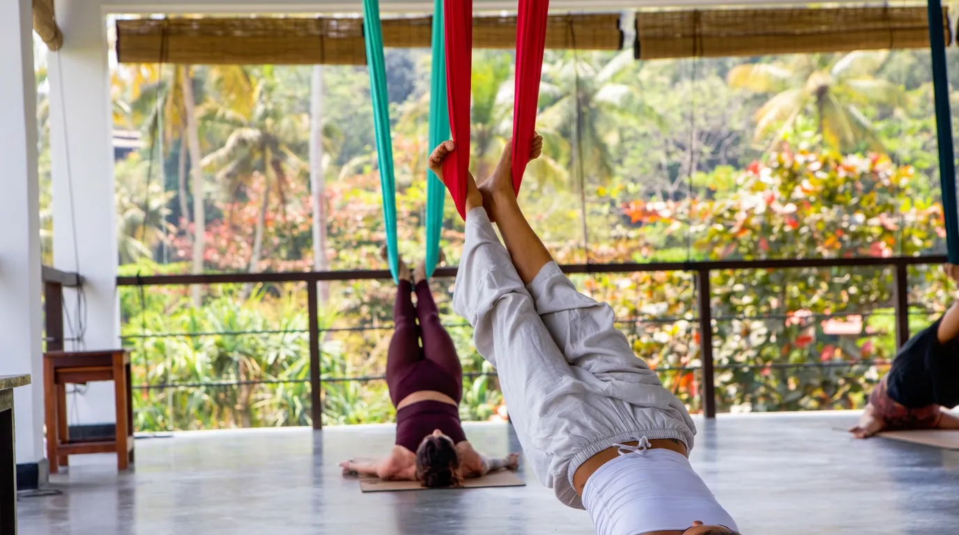Aerial yoga class in an open-air shala at Talalla Retreat