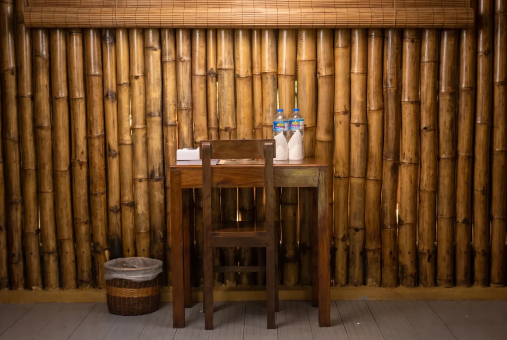 Writing desk against a bamboo wall at Talalla Retreat