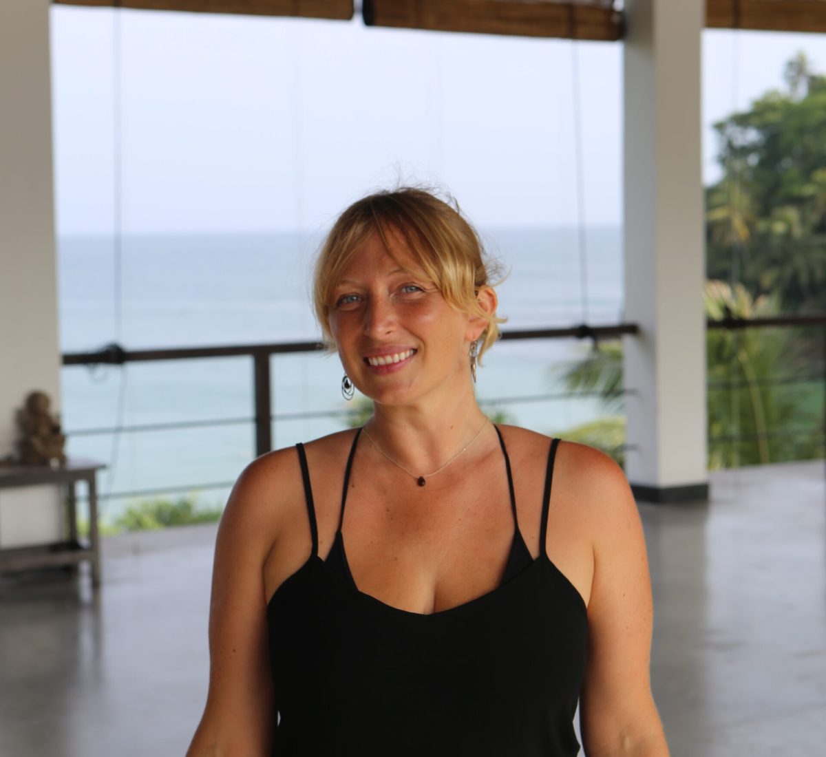 Yoga teacher Melanie in the open-air ocean-view shala at Talalla Retreat, Sri Lanka