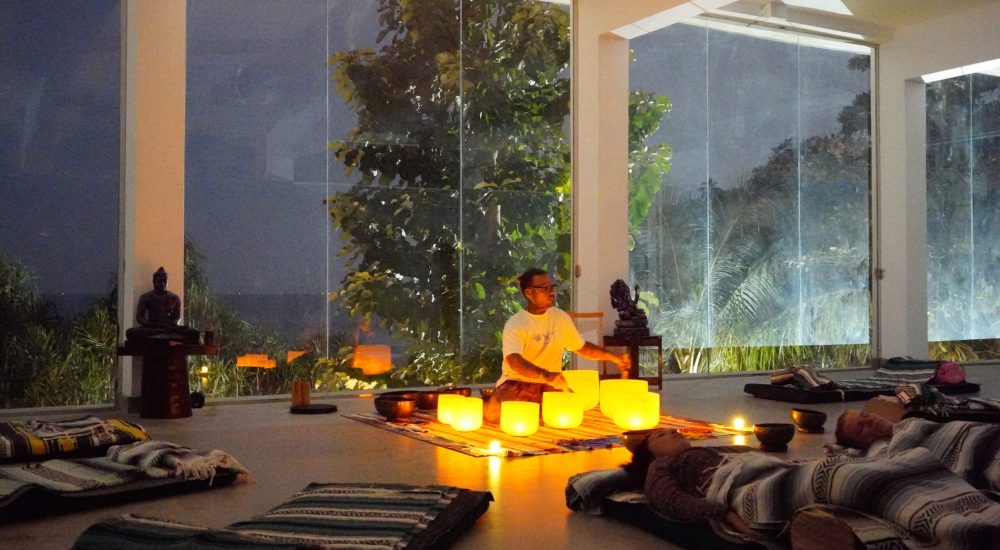 Candlelit sound healing session with crystal singing bowls at Talalla Retreat, Sri Lanka